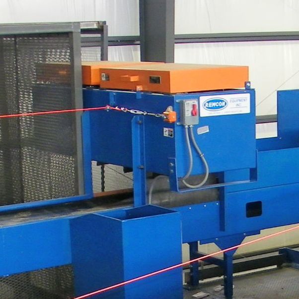 Remcon overhead magnetic separator mounted above a sort conveyor.